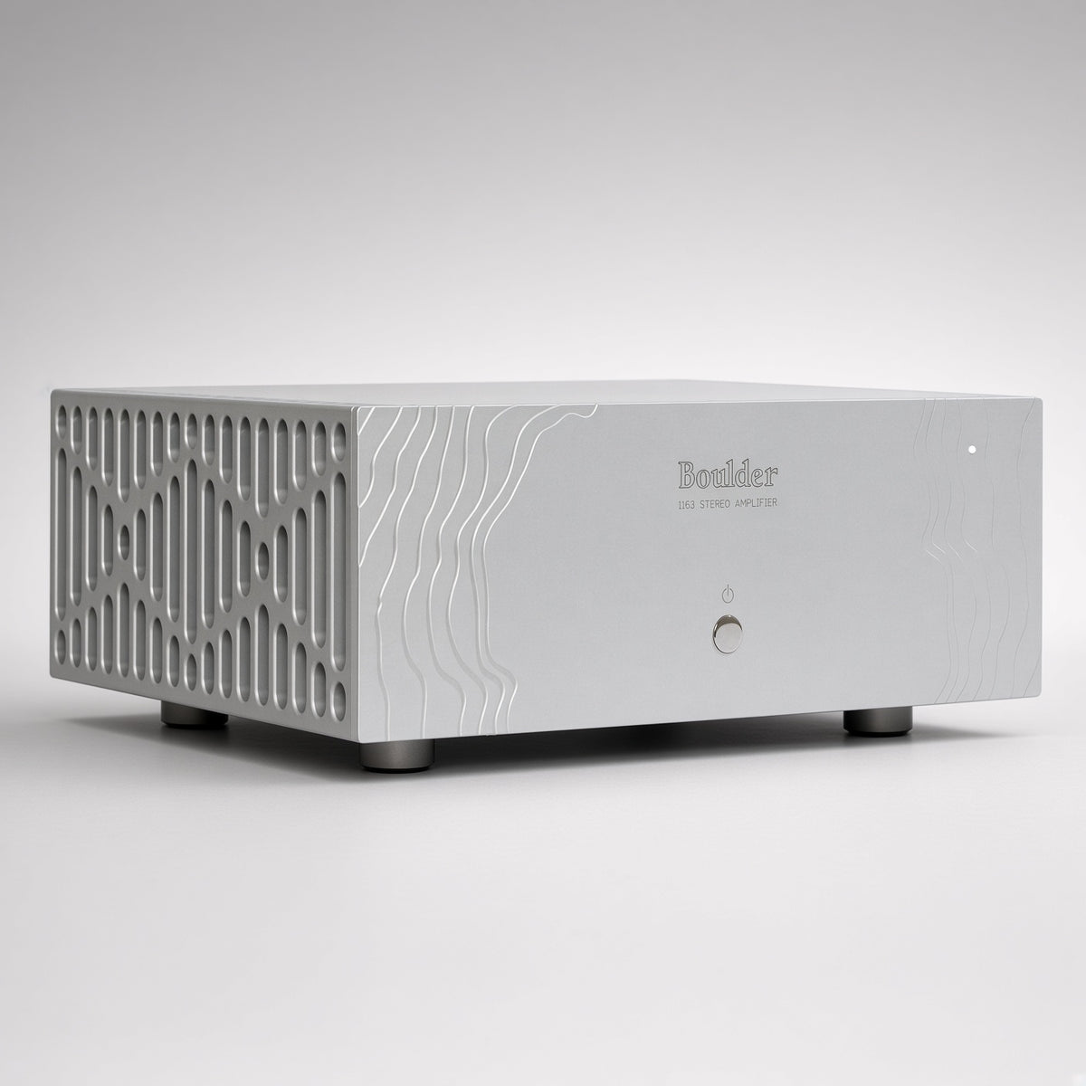 Boulder 1163 stereo power amplifier front view, silver topographic panel with lattice side vents and status LED