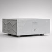 Boulder 1163 stereo power amplifier front view, silver topographic panel with lattice side vents and status LED