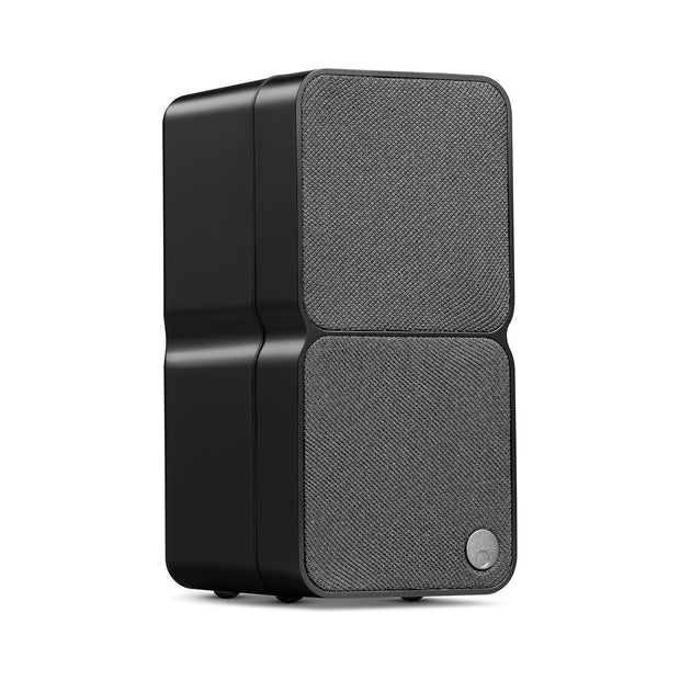 Cambridge Audio MSX20 passive speaker in black, three-quarter view with dual fabric grilles