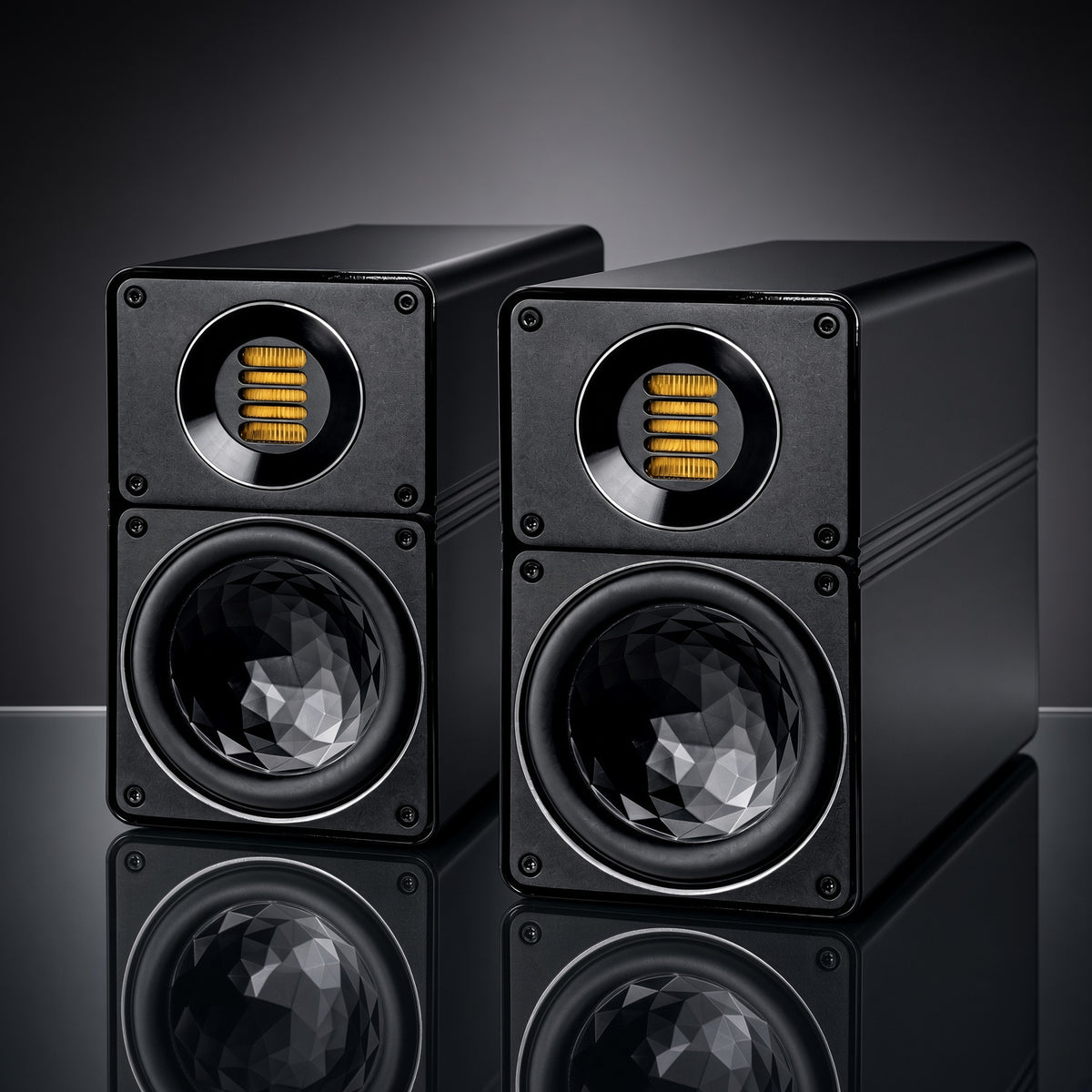 a pair of ELAC BS312.2 speakers in black colo