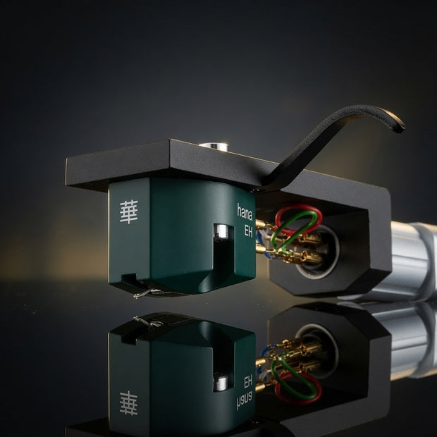Close-up of Hana EH MC cartridge showing aluminum cantilever, elliptical stylus and green housing