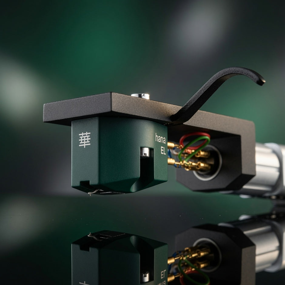 Close-up of Hana EL MC cartridge showing aluminum cantilever, elliptical stylus and moss green housing